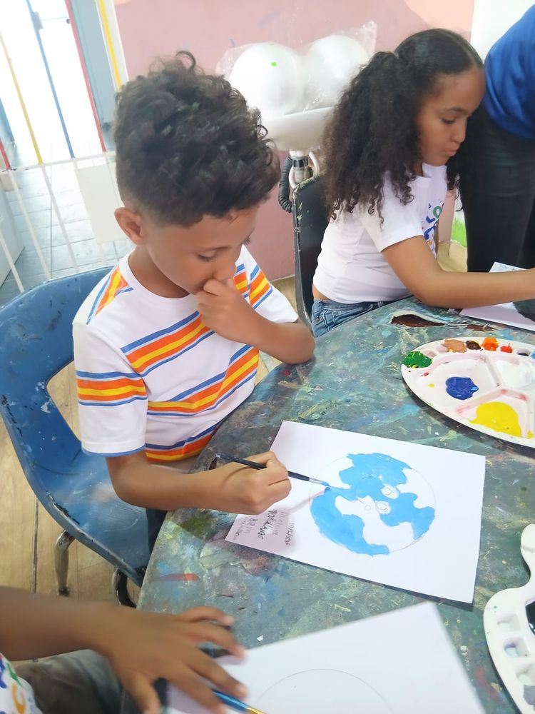 A child painting during a creative therapy session